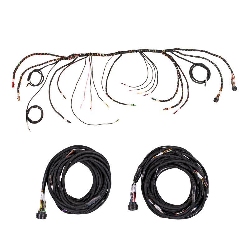 An automotive wiring harness kit with a long multi-wire harness laid out across the top and two coiled black cables with connectors below, shown on a plain white background.