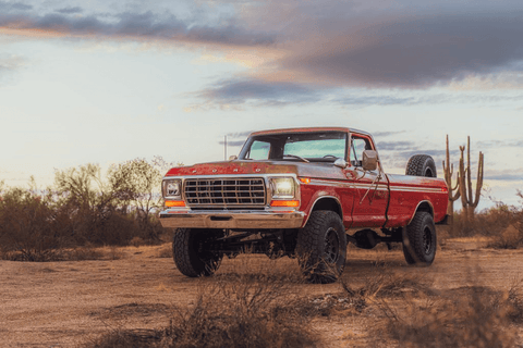 A classic truck parked in a desert landscape highlighting truck rust areas to check before buying a classic truck.