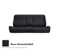 Black leather sofa with vertical stitching on a white background