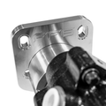 Close-up of a polished metallic mechanical component with a square flange, four bolt holes, and an embossed 'FFG' logo, shown against a white background with part of a dark metal assembly in the foreground.
