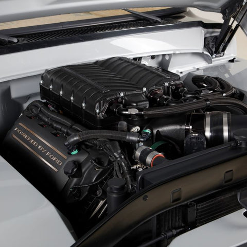 Car engine compartment with 'Powered by Ford' branding