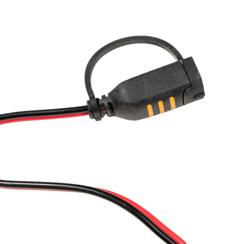 Black electrical connector with red and black wires on a white background