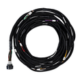 Coiled black cable with connectors on a white background
