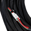 Close-up of black braided cable with red and green wires and labeled color codes.