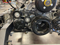 Close-up of a car engine with belts and pulleys