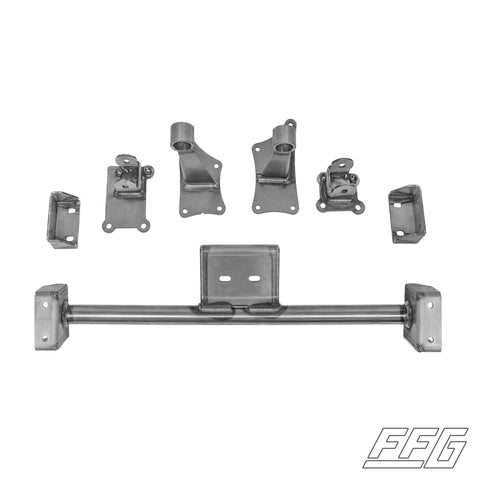 A set of raw steel motor mount kit components laid out on a white background, with no visible branding or product identification.